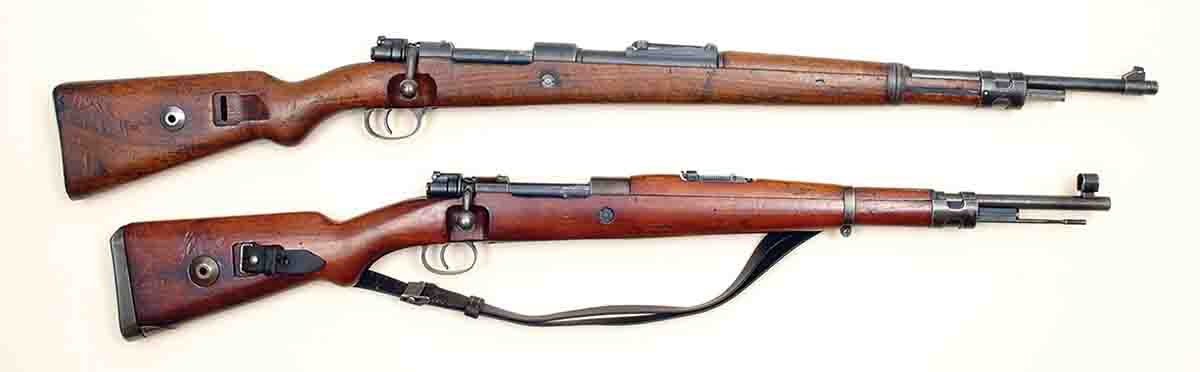 Perhaps the best known Model 1898 Mauser rifles are those used by the German Wehrmacht in World War II. At top is a K98k. At bottom is a Czech-made G33/40. Both were made as 8x57mms.